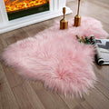 Ashler Faux Fur Area Rug (3' x 2' (Irregular) / Pink)